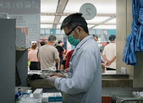 Doctor in a mask working in a clinic in China.