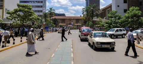 The streets of Nairobi are filled with passengers and vehicles.