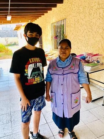 2nd place winner Cesar Miranda at Casa Uedes delivering supplies. 