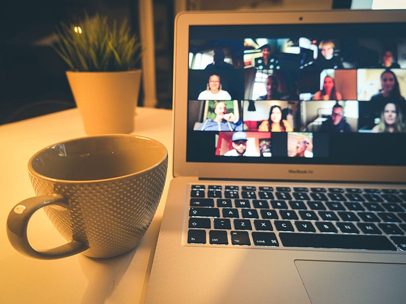 Employees at an international organization meet with each other on a video conference call during a global crisis.