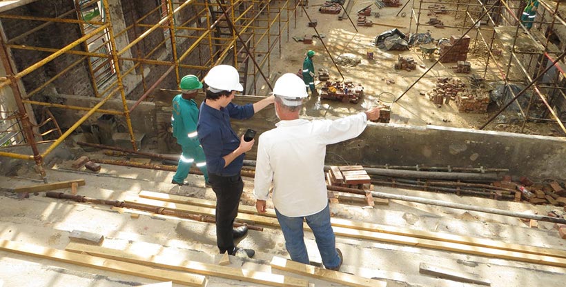 Contractors working on a building site abroad.