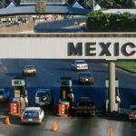 Expats enter a border checkpoint via car, leaving the United States for a new life in Mexico.